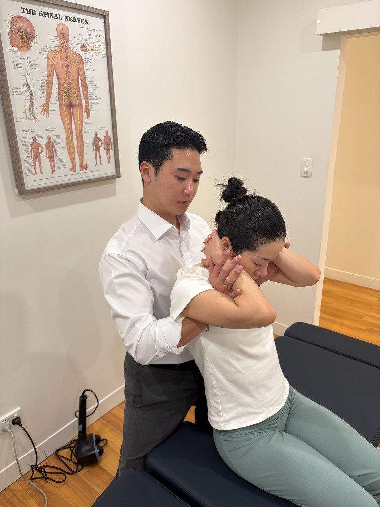 Chiropractor providing care in a treatment setting